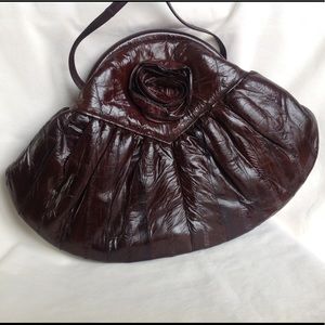 Eel skin leather clutch, rose decorated excellent